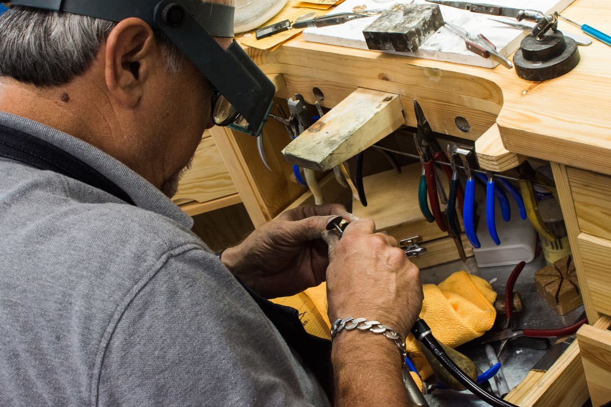 Jeweler performing a jewelry repair at Florida Diamond Center in Holiday, FL